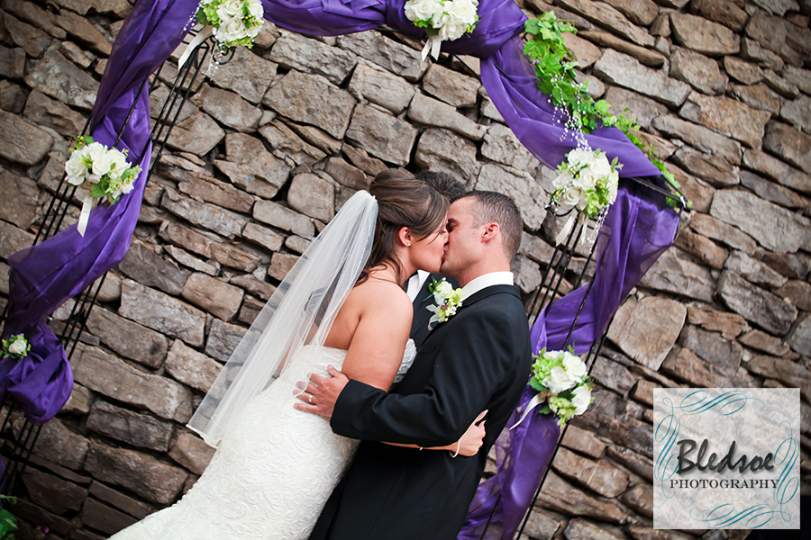Bride and groom kiss at Knoxville Botanical Gardens wedding.