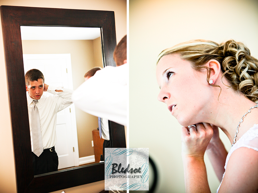 Groom adjusting tie in mirror and bride putting on her earrings at Dara's Garden.