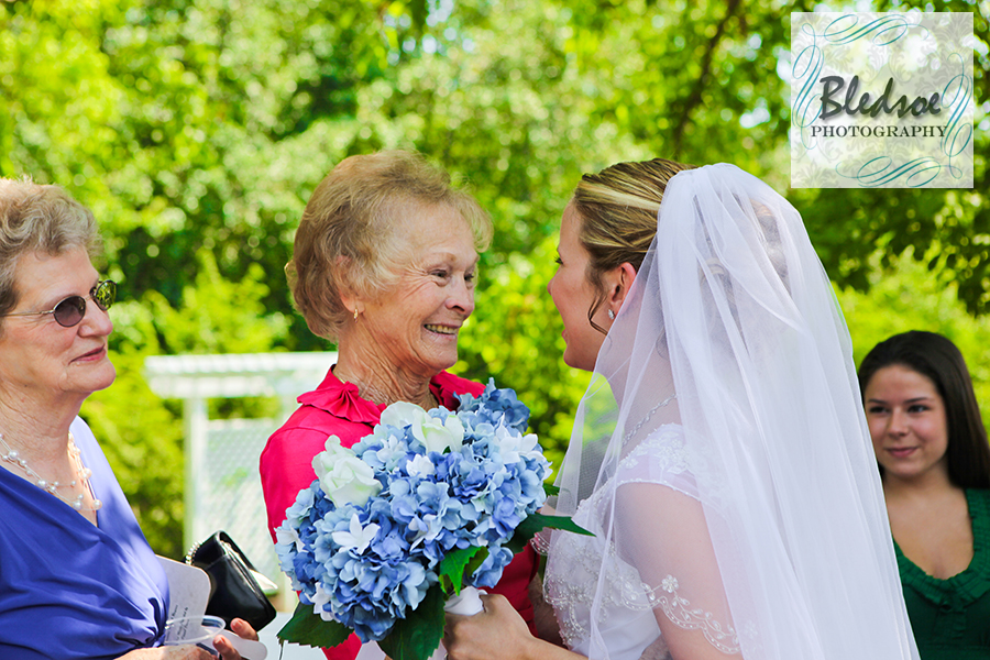 Grandmother smiling at bride at Dara's Garden wedding.