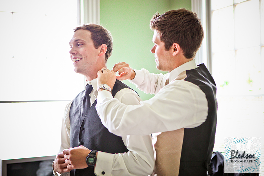 Groom fixing collar. Wedding at The Dent House in Chattanooga, TN. © Bledsoe Photography