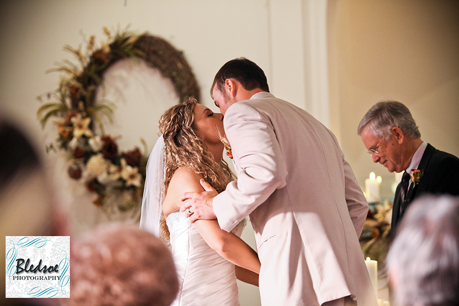 Bride and groom's first kiss. Bledsoe Photography.  Franklin KY wedding photography