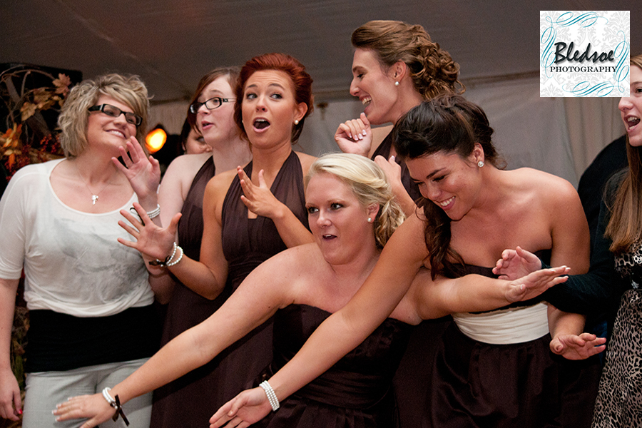 Bridesmaids fighting for bouquet. Bledsoe Photography.  Springfield, TN wedding photography