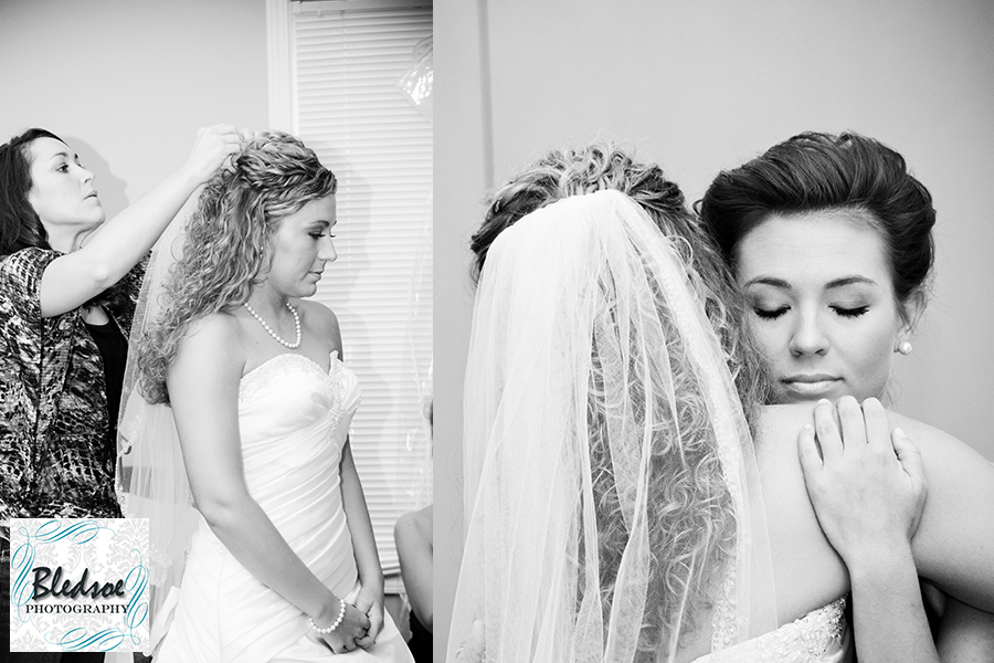 Bride getting dressed.  Bride hugging bridesmaid. Bledsoe Photography.  Franklin KY wedding photography