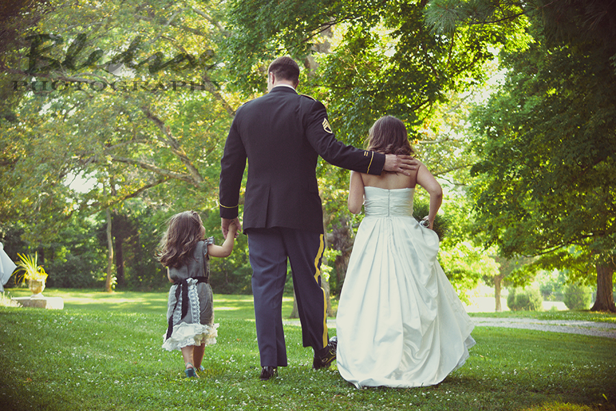 Marine groom, his bride and stepdaughter walking away from ceremony at Glenmore Mansion wedding. Knoxville Wedding Photographer. © Bledsoe Photography