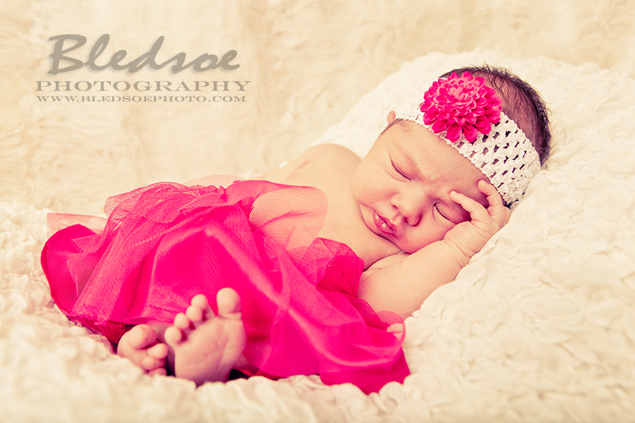 Baby in pink tutu and headband. Knoxville newborn baby photographer, © Bledsoe Photography