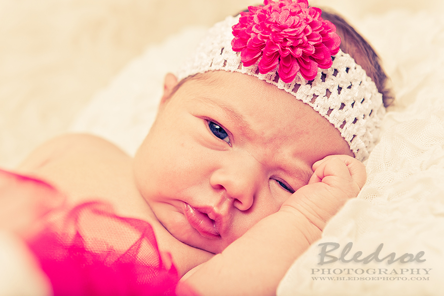 Baby in pink tutu and headband, Knoxville newborn baby photographer, © Bledsoe Photography