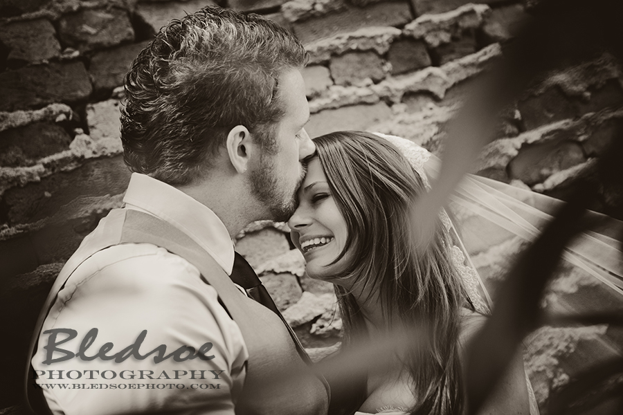 Bride and groom in graffiti alley, Market Square Knoxville after wedding portrait session, © Bledsoe Photography