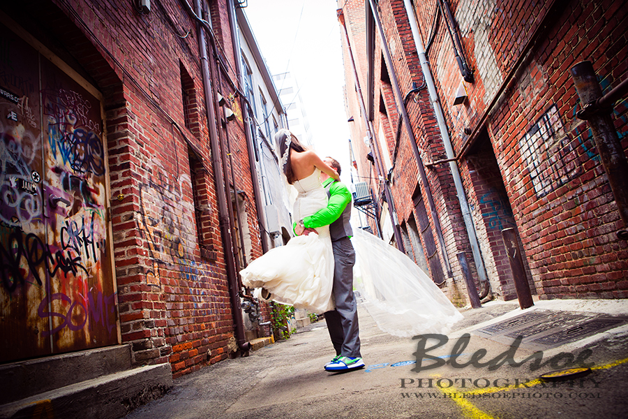 Bride and groom in graffiti alley, Knoxville after wedding portrait session, © Bledsoe Photography