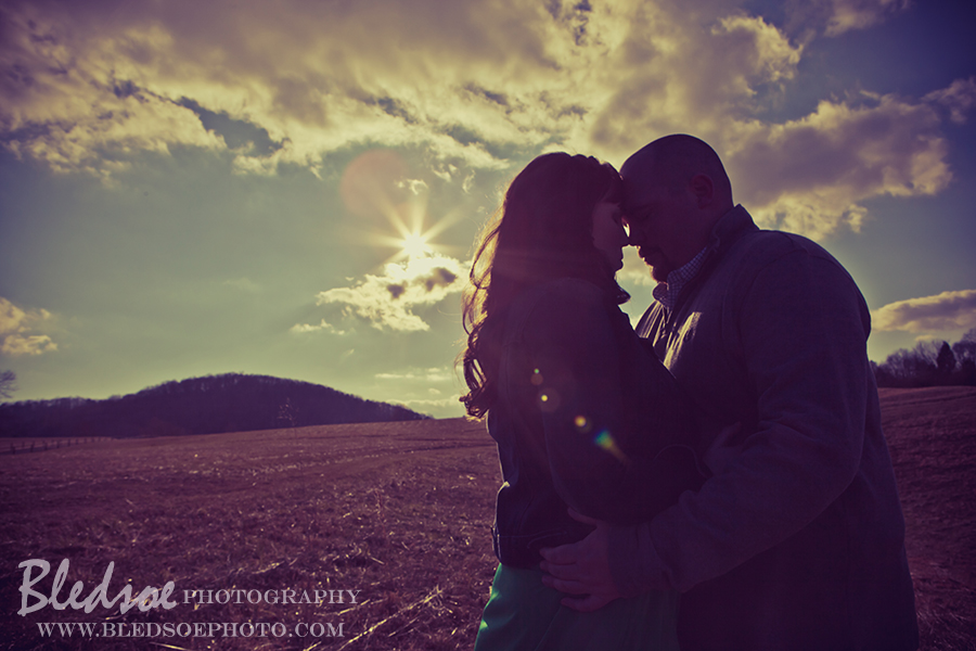 Engagement photo session at Melton Hill Lake, moody clouds and sun flare, © Bledsoe Photography