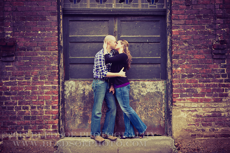 Knoxville engagement photo session, kissing in the Old City, © Bledsoe Photography