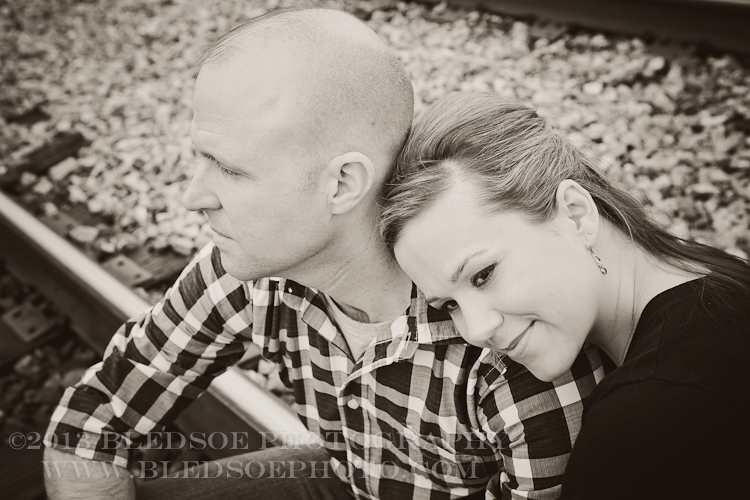 Knoxville engagement photo session in the Old City, black and white of couple on the railroad tracks © Bledsoe Photography