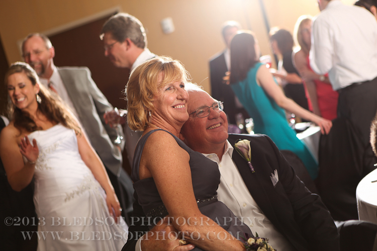 Groom's parents smiling, candid shot at downton hilton, knoxville wedding photographer, ©Bledsoe Photography