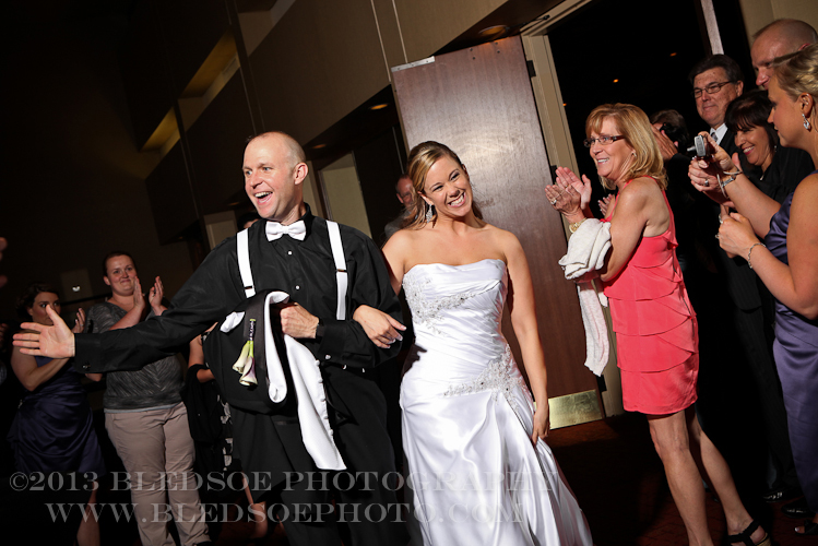 bride and groom's grand exit getaway at downtown Hilton, knoxville wedding photographer, ©Bledsoe Photography
