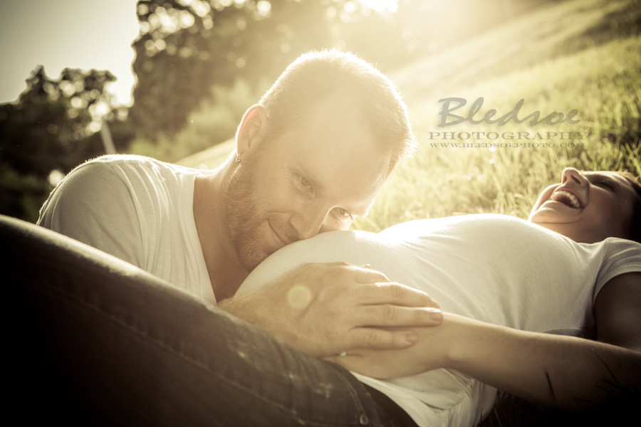 Knoxville maternity photographer, © Bledsoe Photography, baby belly photo session in a garden, daddy's head on pregnant belly