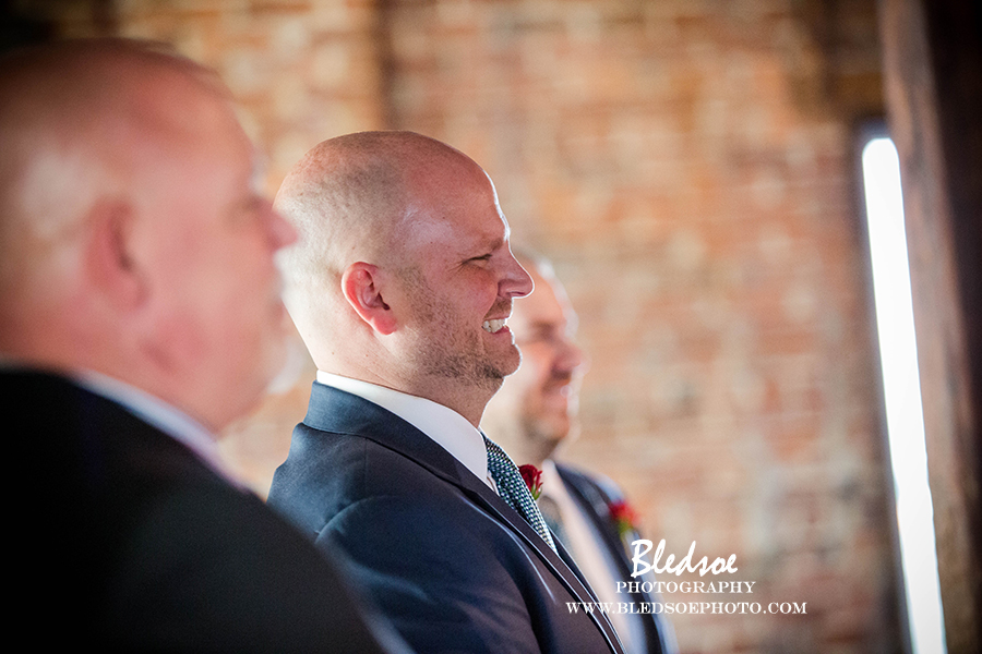 nashville-wedding-cannery-one-navy-suit-ceremony-groom-smiling