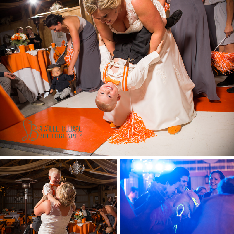wedding reception, legacy springs event center, Knoxville wedding  photographer, Bledsoe photography, orange and white UT Vols wedding, red barn, reception, bride dancing with young son