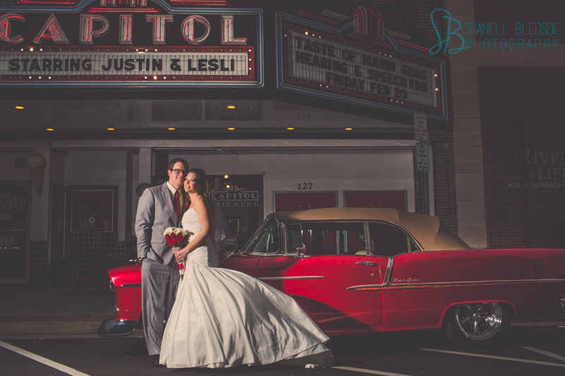 Old Hollywood glam art deco wedding at Capitol Theatre in Maryville, TN. Navy, red, gray wedding colors, bride and groom outside old theatre, vintage convertible Bel Air