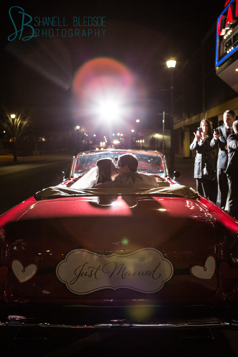 Old Hollywood glam art deco wedding at Capitol Theatre in Maryville, TN. Vintage convertible Bel Air getaway car