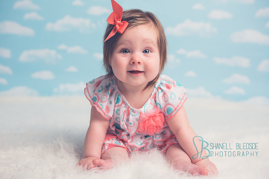 6 month baby girl photos portraits in knoxville, TN, clouds, fur rug, teal, coral
