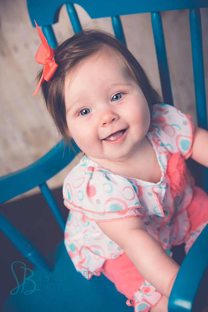 6 month baby girl photos portraits in knoxville, TN, teal rocking chair, coral.
