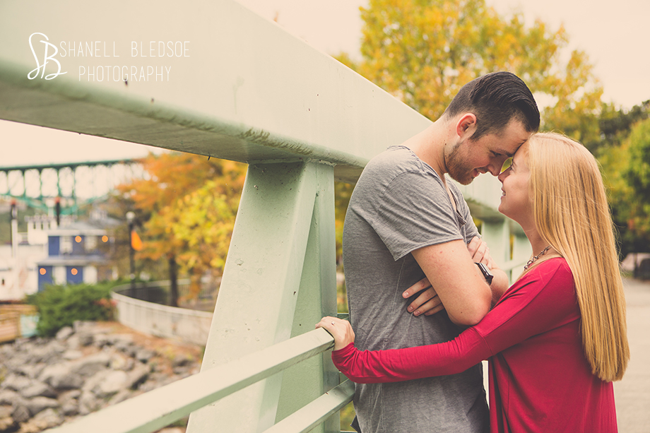 Couple on bridge at Volunteer Landing. Shanell Bledsoe Photography, autumn engagement photos, Knoxville