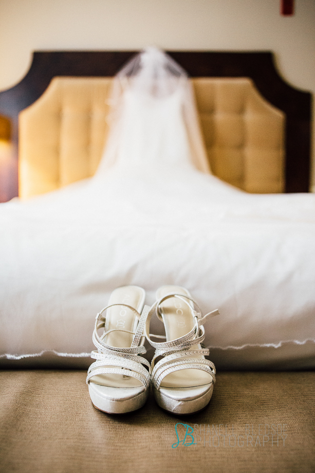 Knoxville wedding, Oliver Hotel, Wedding dress and shoes on bed, shanell bledsoe photography
