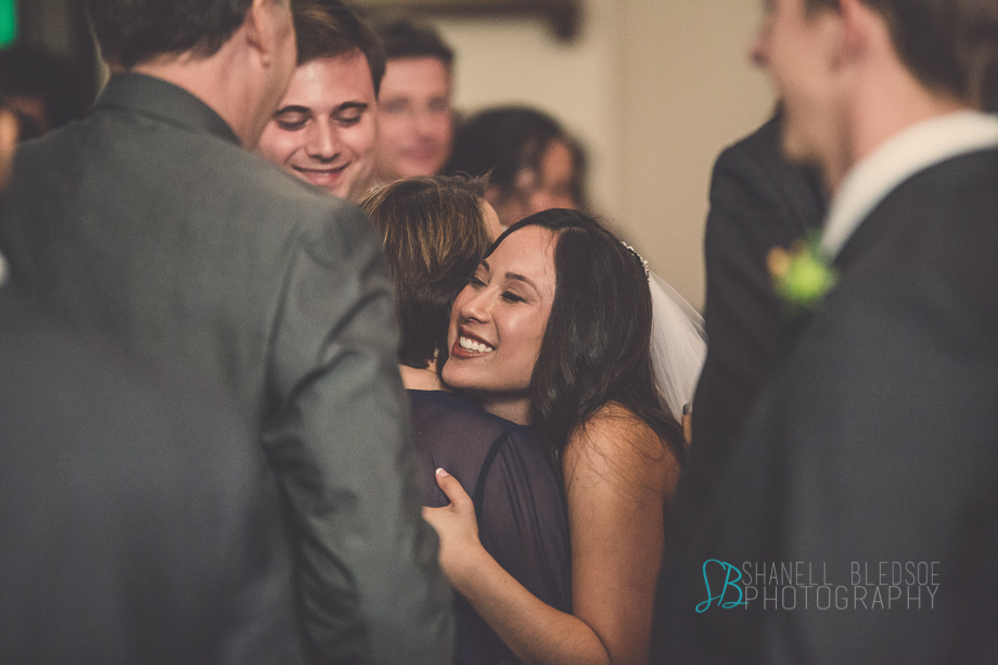Knoxville wedding, bride hugging mother of the groom, lmmaculate Conception Church, shanell bledsoe photography