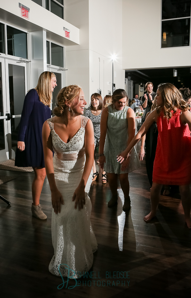 Guests dancing at wedding reception, cha cha slide