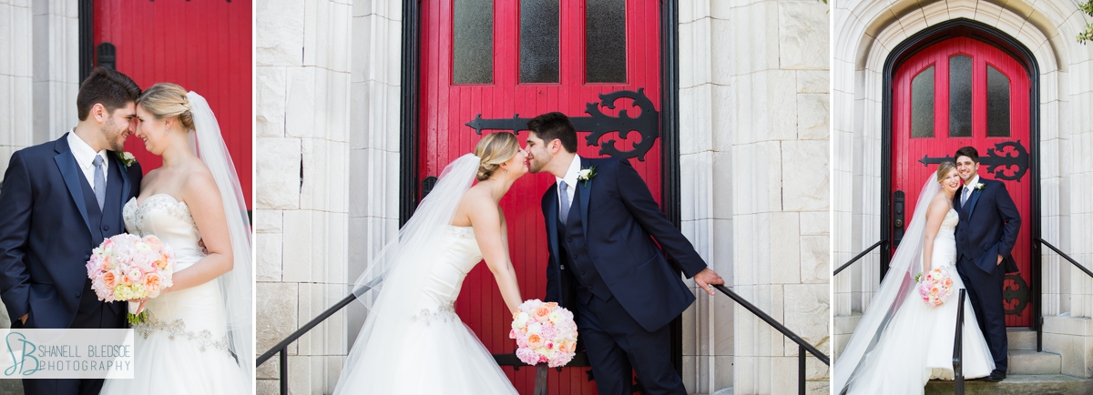 bride and groom in front of red door at st john's lutheran church in knoxville