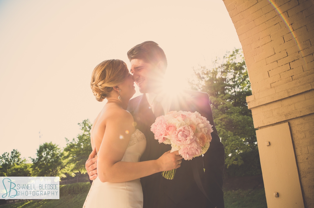 Bride and groom at sunset, sun flare, The Southern Railway Station in Knoxville, TN
