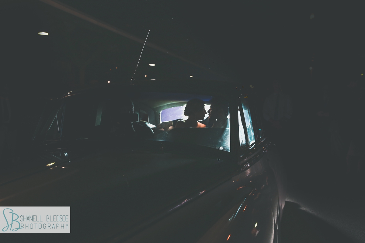 Silhouette of bride and groom in back seat of vintage Bentley, Regal Carriages, Knoxville TN