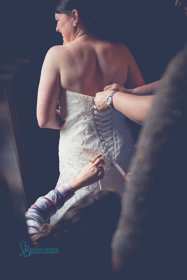 Lace up back wedding dress - bride getting ready