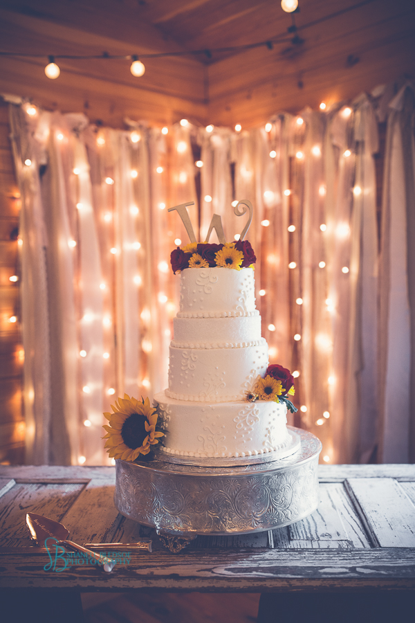 white wedding cake four tier sunflowers