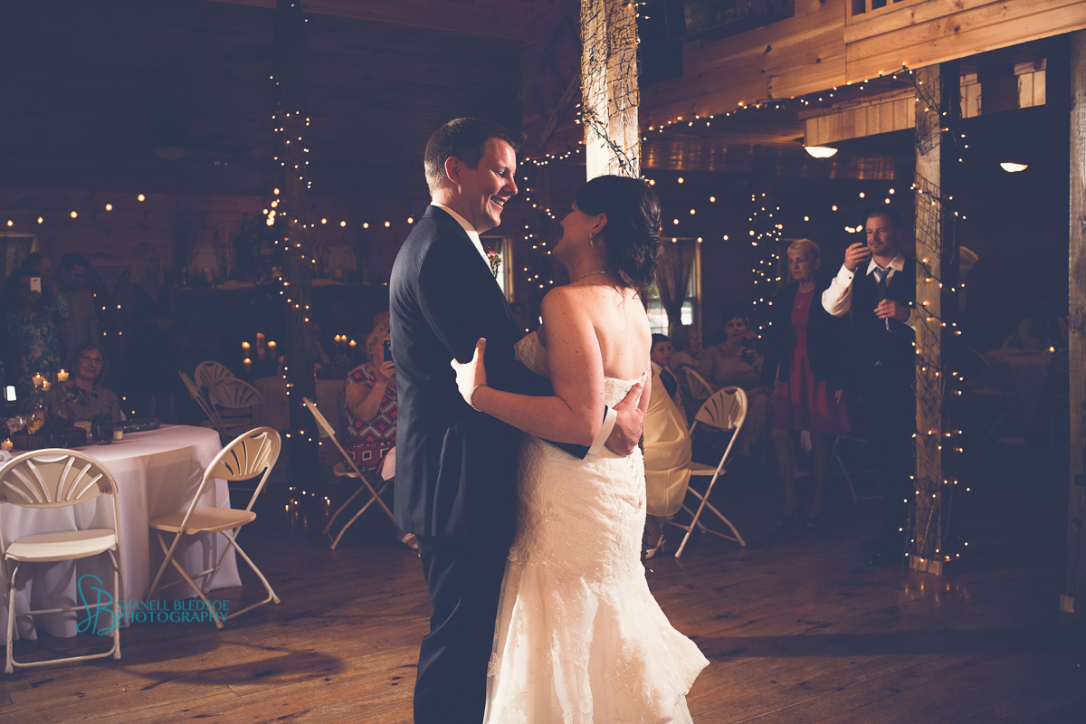 first dance as bride and groom in bonny red barn