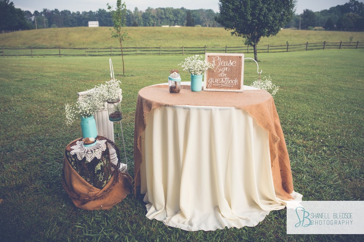 burlap-and-lace-wedding-guestbook-table-blue-mason-jars