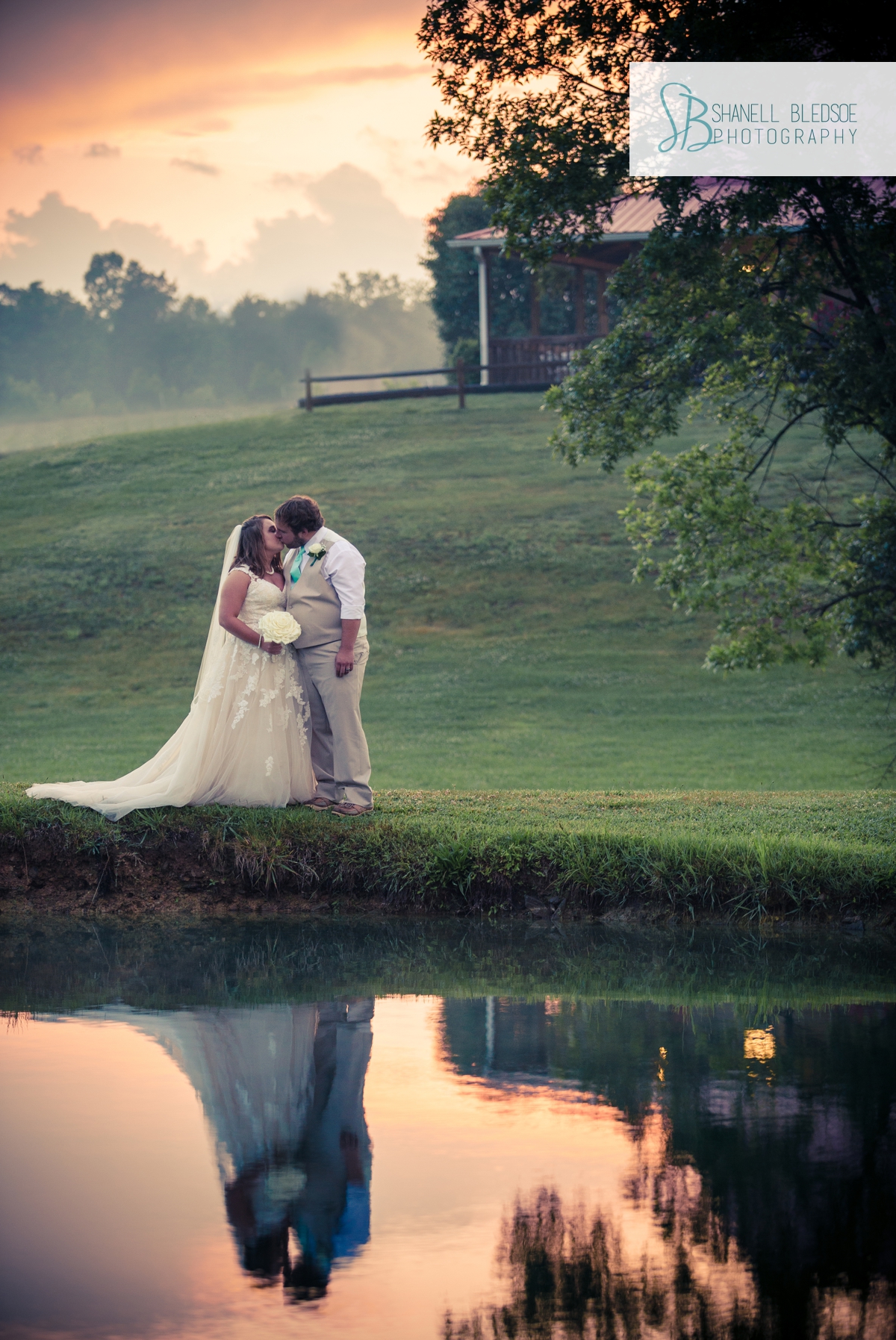 bride-and-groom-reflection-in-water-at-sunset-wedding