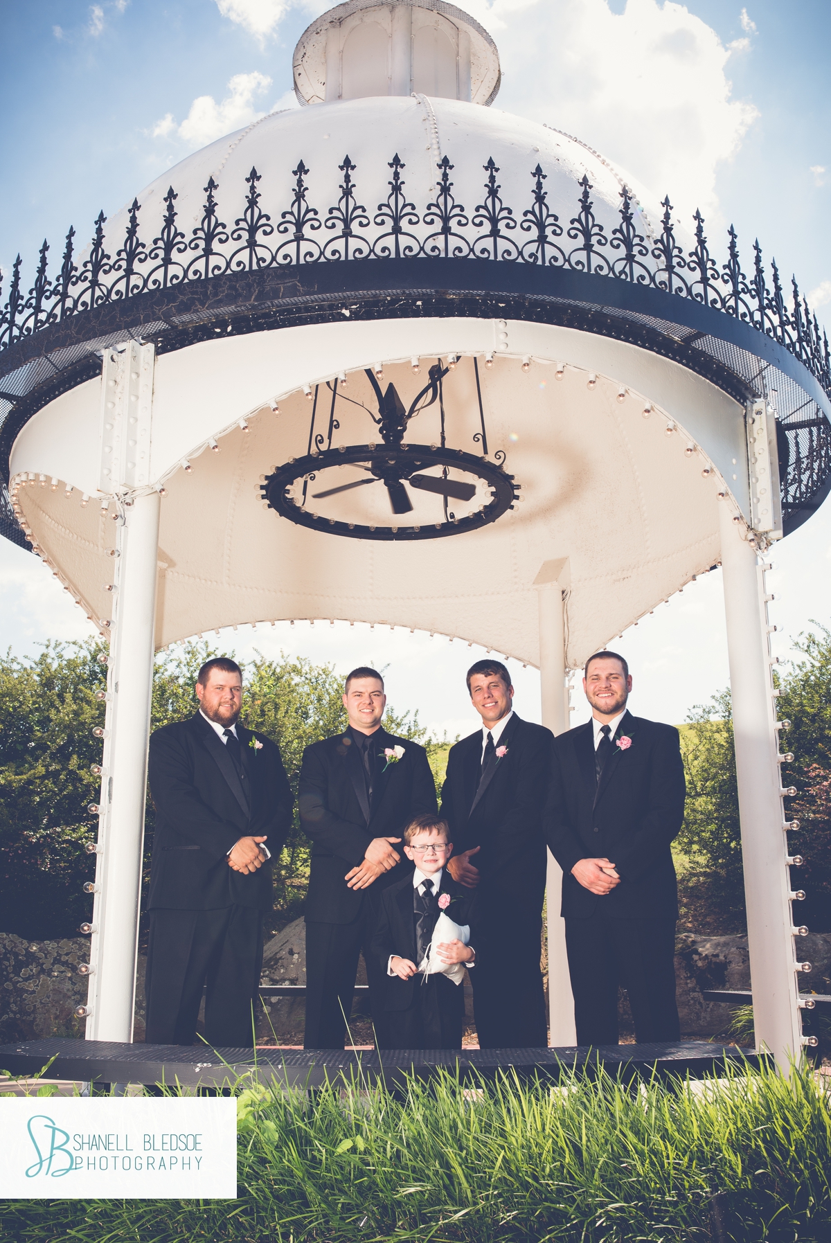 Groom and groomsmen inside gazebo at The Stables in LaFollette, TN