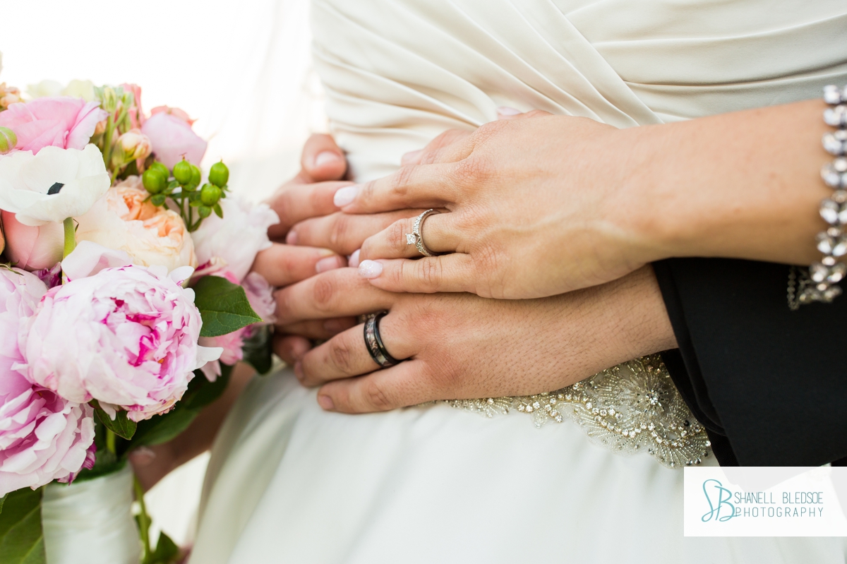 closeup of hands and wedding rings
