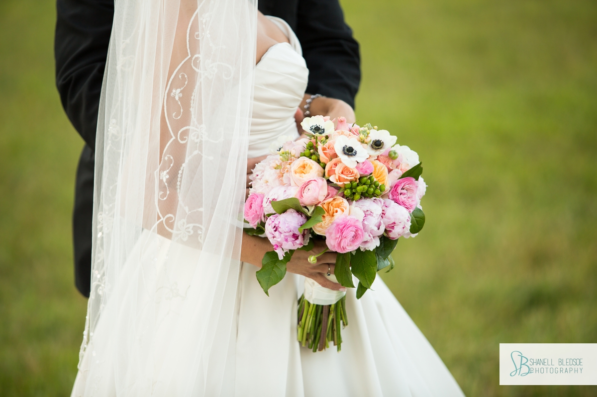 closeup of bride's bouquet of peonies and roses by Sam Franklin