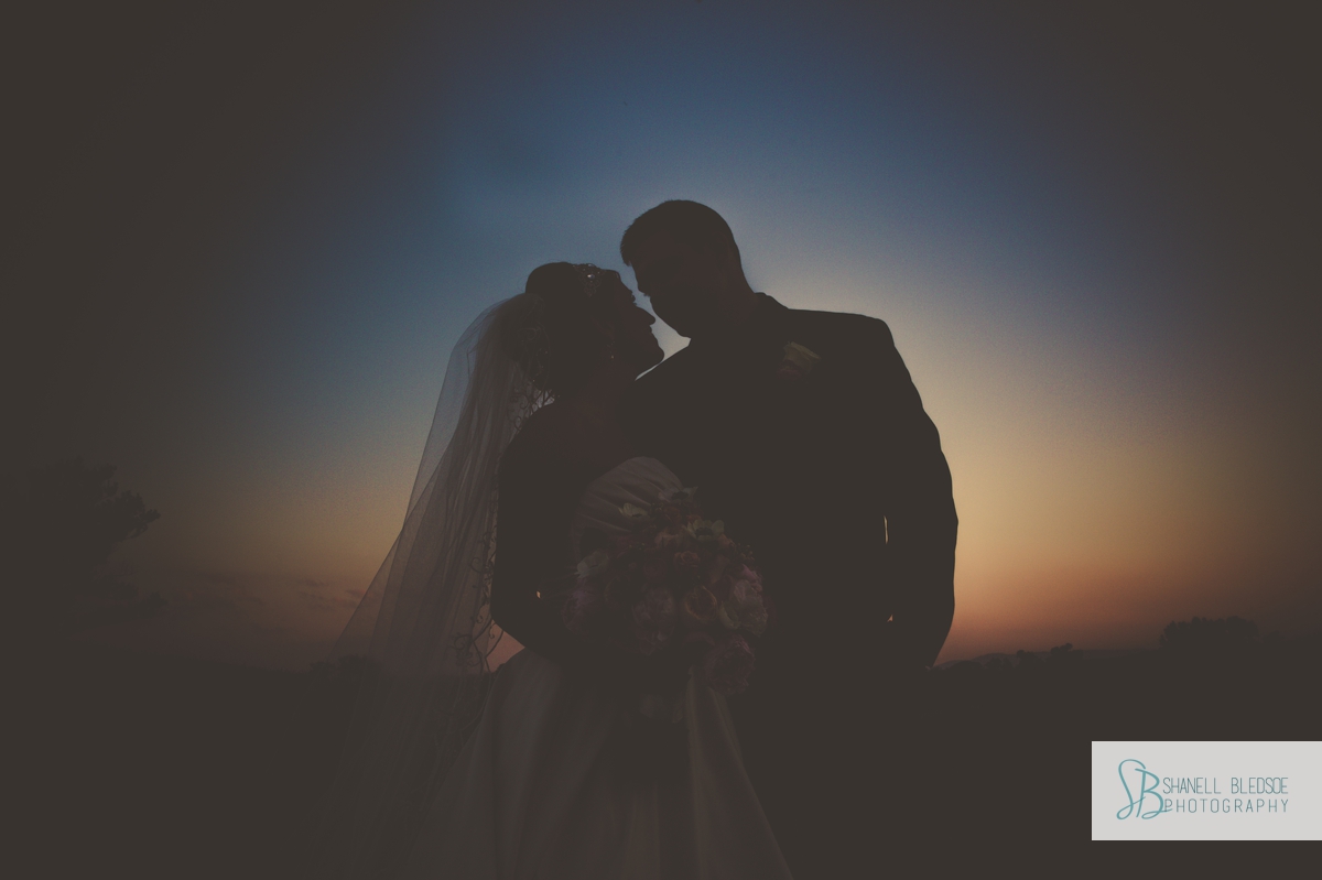 Bride and groom silhouette at sunset