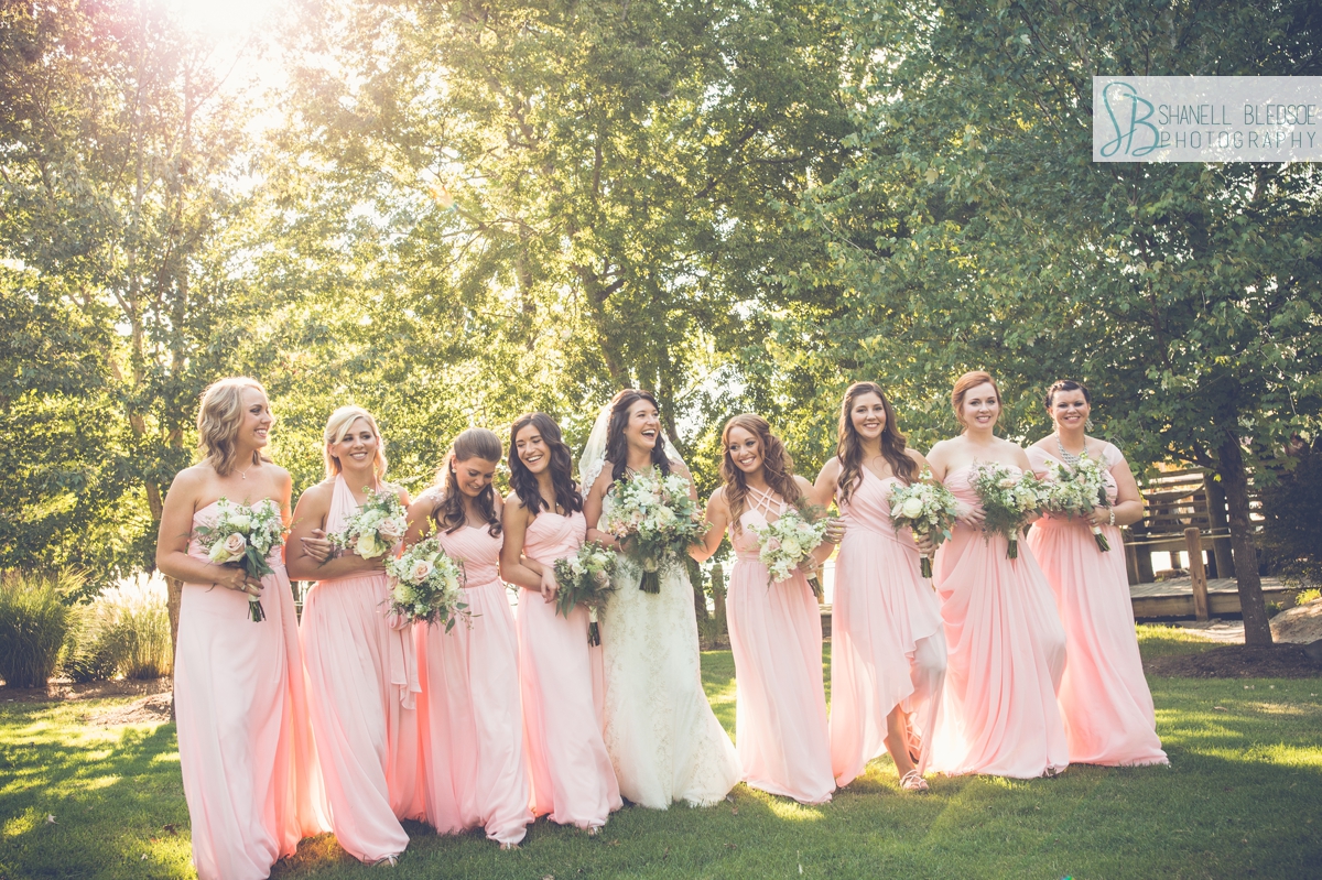 Bride walking with bridesmaids in pink at Hunter Valley Farm