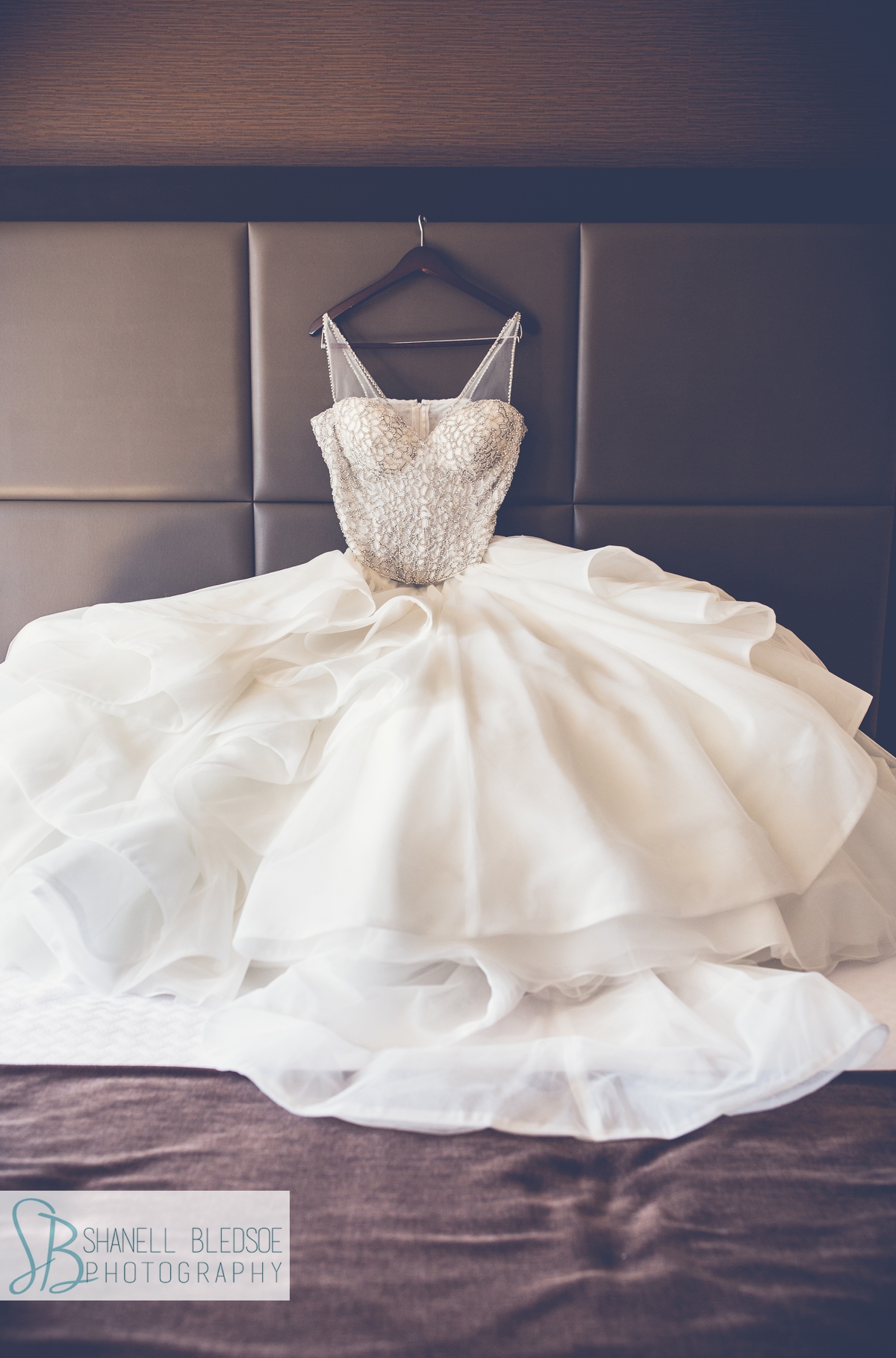 Martina Liana wedding dress on hotel bed