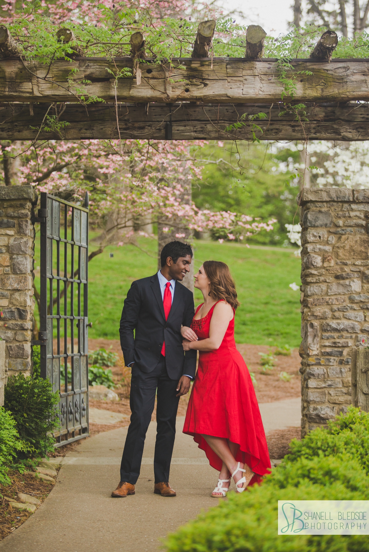 Couple at the gate of Howe Garden at Cheekwood engagement