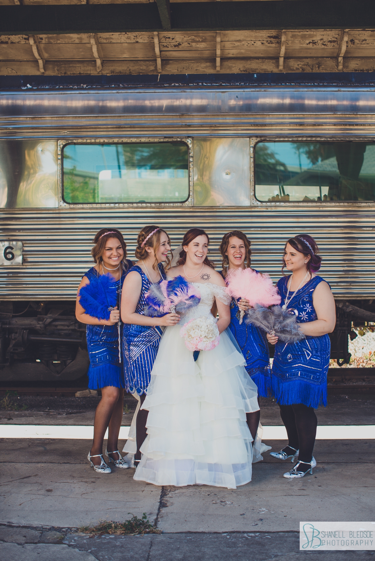 Wedding party on train cars at historic southern railway station