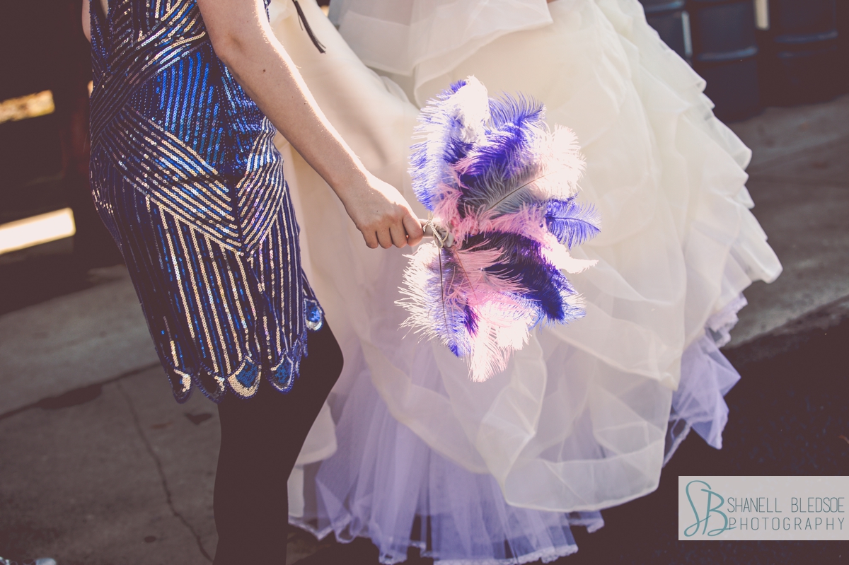 pink and blue feather fan bridesmaid bouquet