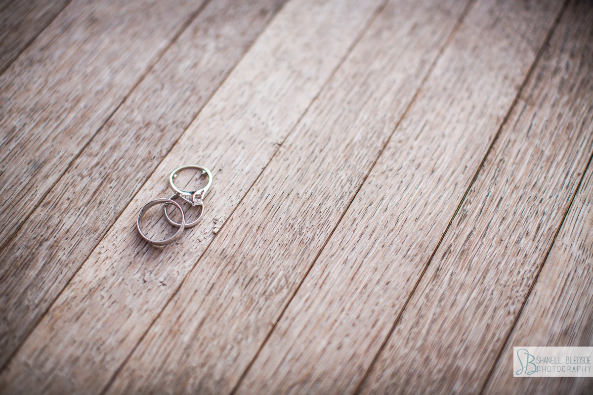 wedding rings on wood closeup