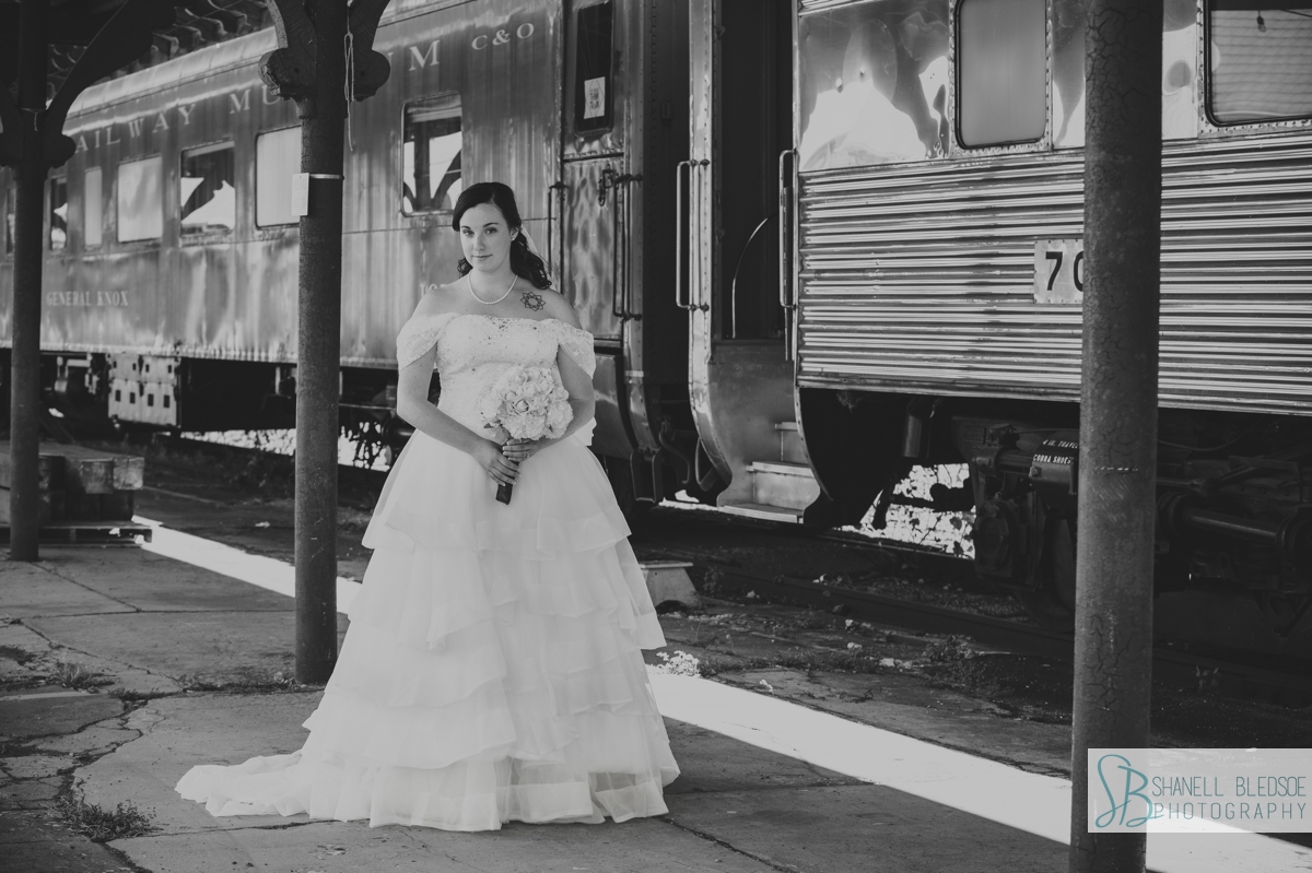 bride bridal portrait in front of train cars at train station wedding in knoxville