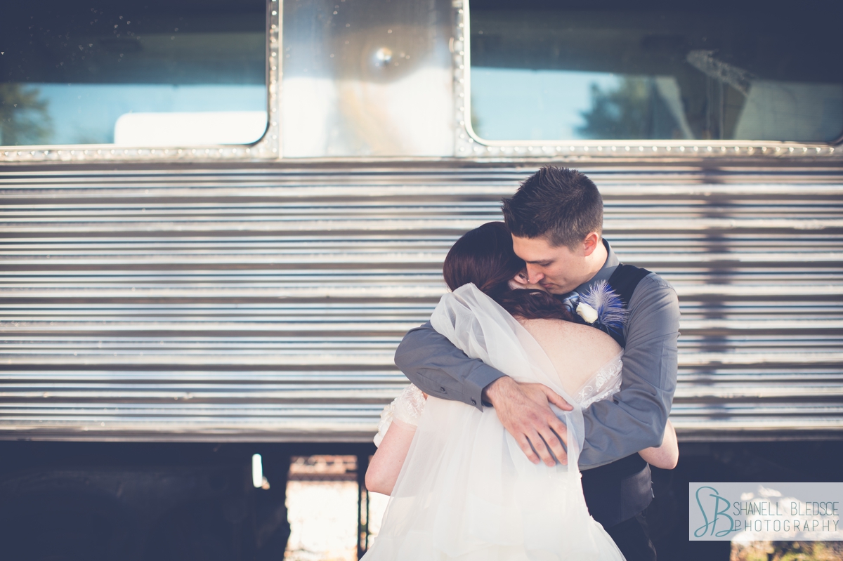 bride and groom at historic southern railway station in knoxville wedding photos