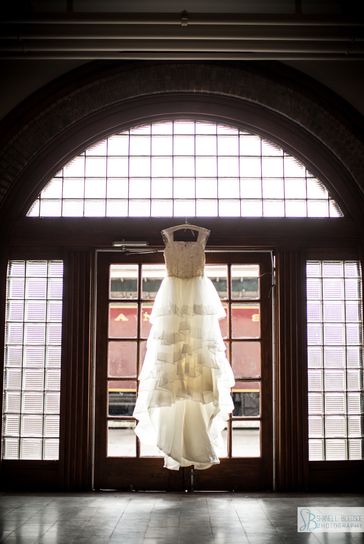 wedding dress in arched window at Historic Southern Railway Station Knoxville