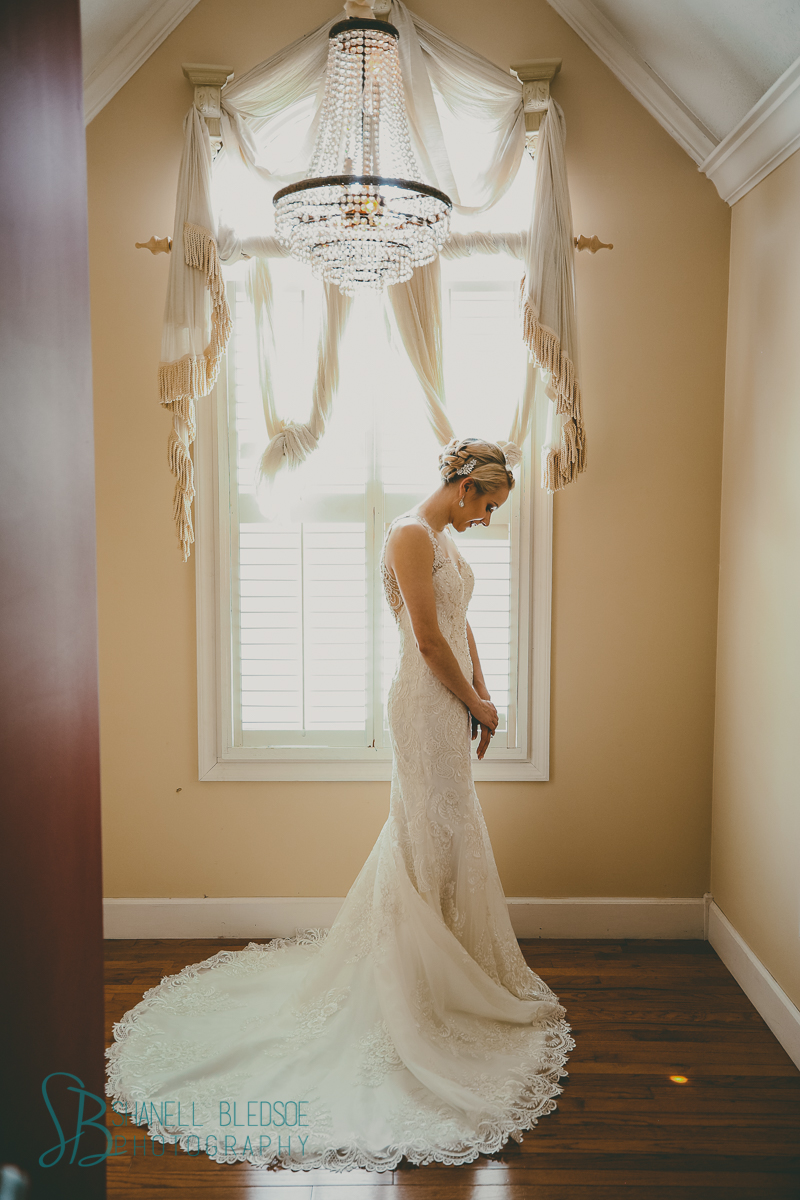 bridal portrait arched window chandelier